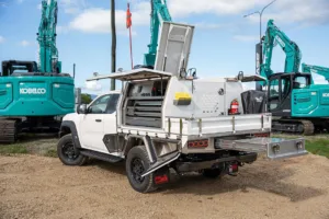 Ford Super Duty with twin gullwing toolboxes left corner rear