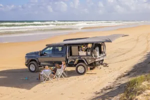Chevrolet Silverado 2500 with Norweld Compact Deluxe Canopy set up for a family beach camp