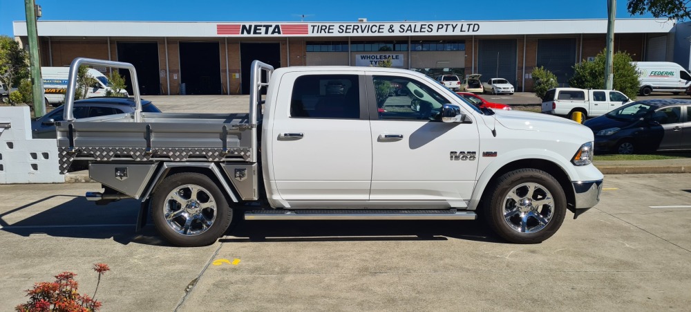 This is a image of a heavy duty ute tray called deluxe tray on a RAM 1500 driver shot
