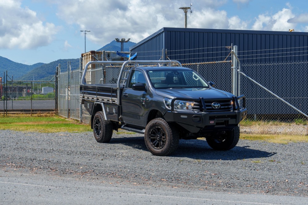 This is a image of a Heavy Duty Aluminium Ute Tray's  on a Toyota Hilux Front on with wheels turned