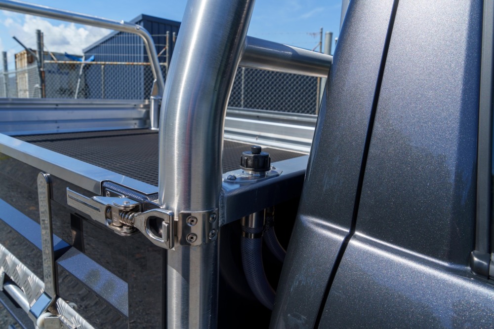 This is a image of a Heavy Duty Aluminium Ute Tray's  on a Toyota Hilux showcasing the stainless steel latches