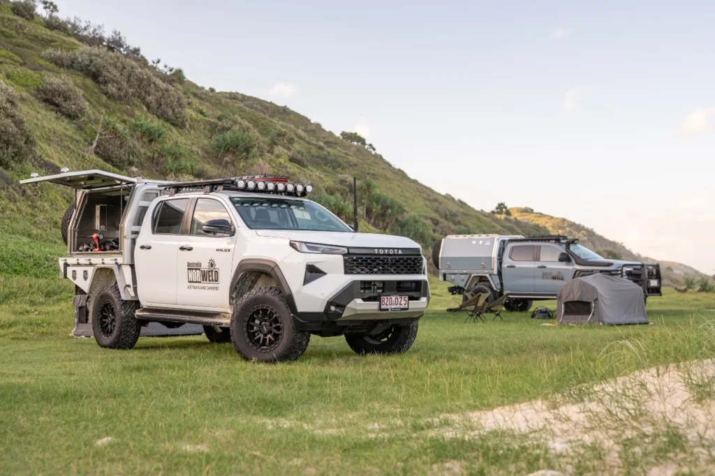 Toyota Hilux dual cab with Norweld canopy set up at a coastal campsite