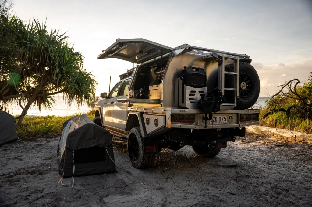Toyota LandCruiser 79 Series with Norweld canopy set up for camping near the beach